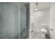 Modern bathroom with a glass shower door and stone tile at 1770 Akron St, Aurora, CO 80010