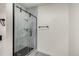 Modern bathroom with a glass shower door and black accents at 1770 Akron St, Aurora, CO 80010