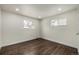 Well-lit bedroom with hardwood floors and neutral walls at 1770 Akron St, Aurora, CO 80010