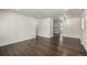 Dining area with dark hardwood floors and kitchen view at 1770 Akron St, Aurora, CO 80010