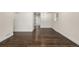 Dining room with dark hardwood floors and view into kitchen at 1770 Akron St, Aurora, CO 80010