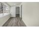 Clean hallway with hardwood floors and access to other rooms at 1770 Akron St, Aurora, CO 80010