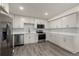 Modern kitchen with stainless steel appliances and white cabinets at 1770 Akron St, Aurora, CO 80010