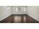 Spacious living room with dark hardwood floors and neutral walls at 1770 Akron St, Aurora, CO 80010