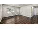 Bright living room with hardwood floors and access to hallway at 1770 Akron St, Aurora, CO 80010