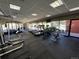 Community gym featuring treadmills, weights, and other equipment, with a pool view at 100 Park Ave # 1405, Denver, CO 80205