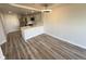 Cozy kitchen area featuring gray cabinetry, a quartz countertop island, and stainless steel appliances at 100 Park Ave # 1405, Denver, CO 80205