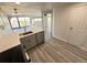 This modern kitchen features stainless steel appliances and luxury vinyl plank flooring at 100 Park Ave # 1405, Denver, CO 80205