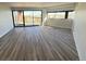 Bright living room with big windows and wood-look floors at 100 Park Ave # 1405, Denver, CO 80205