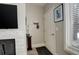 Inviting entryway featuring neutral paint, coat rack, and a modern light fixture at 841 Crisman Dr # 9, Longmont, CO 80501