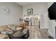 Bright living room with vaulted ceilings, modern fireplace, and seamless flow to kitchen at 841 Crisman Dr # 9, Longmont, CO 80501