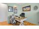 Home office with wood desk and cowhide chairs at 5567 E Asbury Ave, Denver, CO 80222