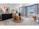 Charming Bedroom featuring a crib, two large black dressers, area rug and plenty of natural light at 3353 N Catawba Way, Aurora, CO 80019