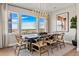 Dining room features bright light from the large window and seating for eight at 3353 N Catawba Way, Aurora, CO 80019
