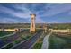 Inviting entrance to the Aurora Highlands community featuring a clock tower and manicured landscaping at 3353 N Catawba Way, Aurora, CO 80019