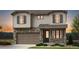 Beautiful two-story home featuring stone accents, a two-car garage, and well-manicured landscaping at 3353 N Catawba Way, Aurora, CO 80019