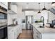 A modern kitchen featuring white countertops, stainless steel appliances, and a gas stovetop at 3353 N Catawba Way, Aurora, CO 80019