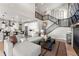 Comfortable living room featuring stairs, large couch, and fireplace at 3353 N Catawba Way, Aurora, CO 80019