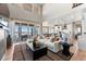 Spacious living room with floor-to-ceiling windows and open layout at 3353 N Catawba Way, Aurora, CO 80019