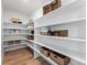 A well-organized pantry with multiple shelves, baskets, and storage for food and kitchen items at 3353 N Catawba Way, Aurora, CO 80019