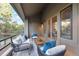Inviting balcony with comfortable seating, and stunning forest views at 867 Hill And Dale Rd # B, Golden, CO 80401