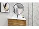 Modern bathroom with new vanity, round mirror, and elegant marble-tiled shower and contemporary art at 867 Hill And Dale Rd # B, Golden, CO 80401