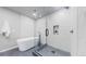 Modern bathroom featuring a soaking tub next to a walk-in shower with frameless glass and contemporary fixtures at 867 Hill And Dale Rd # B, Golden, CO 80401