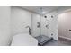 Modern bathroom with soaking tub beside frameless shower and contemporary fixtures, featuring gray and white finishes at 867 Hill And Dale Rd # B, Golden, CO 80401
