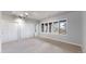 Spacious bedroom with large windows, closets, neutral carpet, and stylish track lighting at 867 Hill And Dale Rd # B, Golden, CO 80401