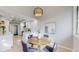 Cozy breakfast nook with a round table, stylish chairs, and a view into the modern kitchen at 867 Hill And Dale Rd # B, Golden, CO 80401