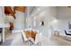Open-concept dining area with a modern table, views of the kitchen, and beautiful natural light at 867 Hill And Dale Rd # B, Golden, CO 80401