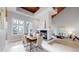 Bright dining room with modern furnishings, fireplace, and floor-to-ceiling windows at 867 Hill And Dale Rd # B, Golden, CO 80401