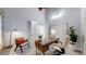 Bright home office with wooden desk, modern chair, and a large window offering ample natural light at 867 Hill And Dale Rd # B, Golden, CO 80401