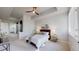 Bright bedroom with soft carpeting, ceiling fan, and scenic views from its large window, a comfortable bed and serene decor at 867 Hill And Dale Rd # B, Golden, CO 80401