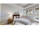 Bright main bedroom features a large window with exterior views and a comfortable bed and serene decor at 867 Hill And Dale Rd # B, Golden, CO 80401