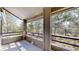 View from covered patio with brick flooring shows surrounding tall trees and natural beauty, perfect for relaxation at 867 Hill And Dale Rd # B, Golden, CO 80401