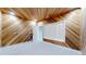 Room with natural wood paneling, gray carpet, and a window with white shutters at 867 Hill And Dale Rd # B, Golden, CO 80401