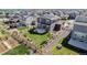 Aerial view showcasing the fenced backyard, patio, and solar panels of this home, and community at 1953 Morgan Dr, Erie, CO 80516