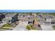 Aerial view highlighting homes in a neighborhood with well-maintained streets and landscaping at 1953 Morgan Dr, Erie, CO 80516