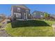 Well-maintained backyard with lush green lawn and a patio, perfect for outdoor entertaining and relaxation at 1953 Morgan Dr, Erie, CO 80516