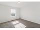 Well-lit bedroom with neutral carpet and a window view at 1953 Morgan Dr, Erie, CO 80516
