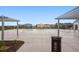 Outdoor community pool featuring covered seating areas, perfect for relaxation and social gatherings at 1953 Morgan Dr, Erie, CO 80516