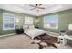 Bright main bedroom with trey ceiling, carpet, and large windows at 1953 Morgan Dr, Erie, CO 80516