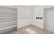 Walk-in closet with carpet, built-in shelving, and a window at 1953 Morgan Dr, Erie, CO 80516