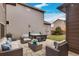 Outdoor living area boasts a hot tub, comfortable seating, and a manicured lawn, ideal for relaxation and social gatherings at 6619 Mariposa Ct, Denver, CO 80221