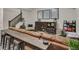 Finished basement with a long table and seating area, great for entertaining and relaxing with a large brown leather sofa at 6619 Mariposa Ct, Denver, CO 80221