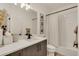 Bright bathroom with modern fixtures, stylish vanity, and tiled shower at 6619 Mariposa Ct, Denver, CO 80221