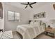 Bright bedroom with a neutral color palette and a window view at 6619 Mariposa Ct, Denver, CO 80221
