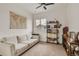 Comfortable bedroom featuring a cozy sofa, stylish shelving, and plenty of natural light at 6619 Mariposa Ct, Denver, CO 80221