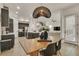 Open floor plan showcases a modern dining area and kitchen, perfect for entertaining and everyday living at 6619 Mariposa Ct, Denver, CO 80221